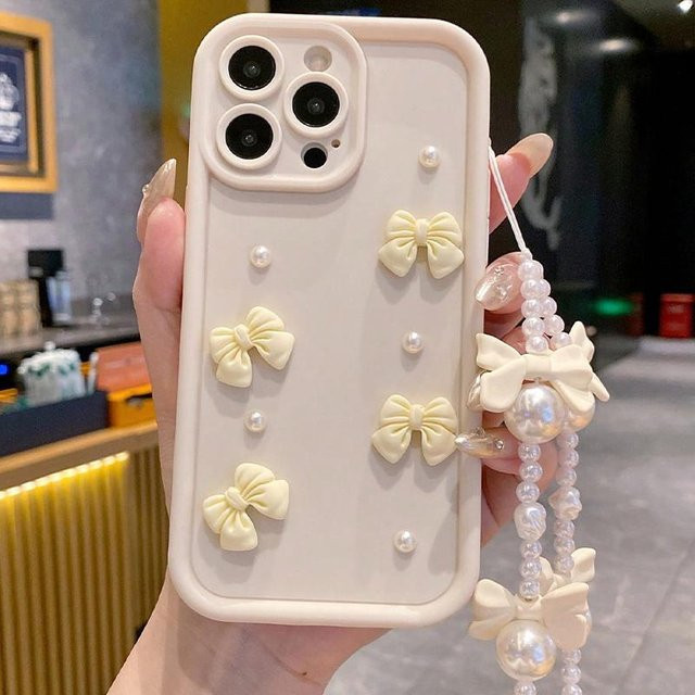 Rui Di Silikon Handyhülle mit 3D Schleife und Perlen sowie Lanyard für iPhone 11 bis iPhone 17 Pro Max in Weiß - Bild 1