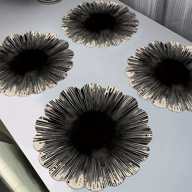 VIKAMA 4-teiliges Tischset mit abstraktem Grafikdesign in Schwarz - Bild 1