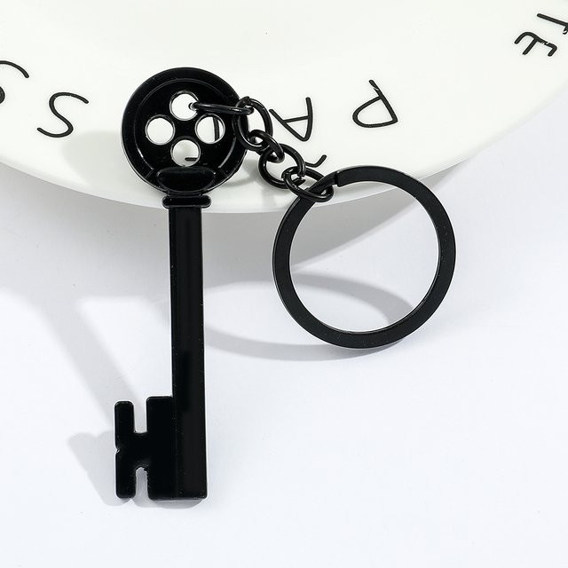 Bandai Coraline Schlüsselanhänger, Schwarzer Knopf, Anhänger - Bild 1