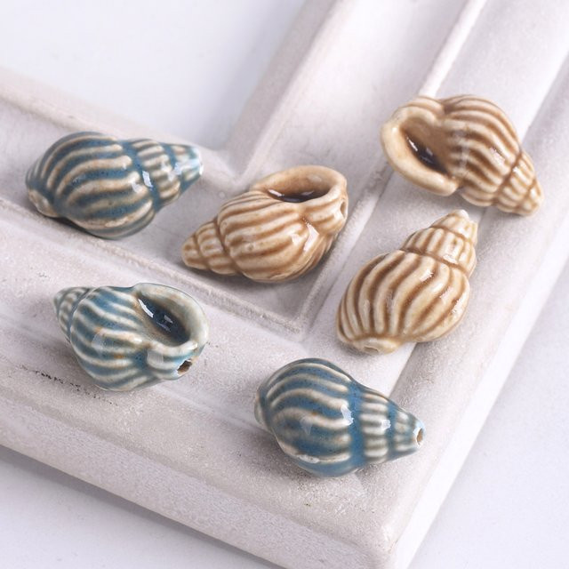 Dreamzeal Keramik-Muschelperlen, gestreifte Meeresschnecken-Anhänger - Bild 1