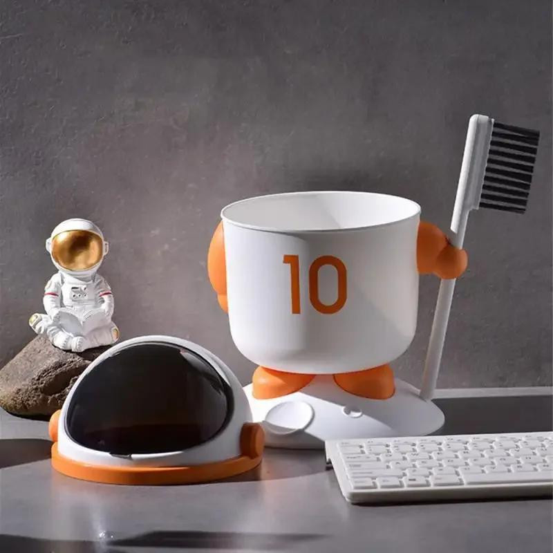 Multifunktionaler Astronaut Desktop Mülleimer mit Bürste als Mini Aufbewahrungsbox für Büro und Haushalt in Orange und Grau - Bild 4