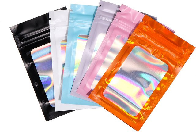 50er Set Holografische Laserfarbene Selbstklebende Kunststoff-Verpackungsbeutel von AGCFABS in Orange und Mehrfarbig für Schmuck und Geschenke mit Zip-Lock-Verschluss - Bild 1