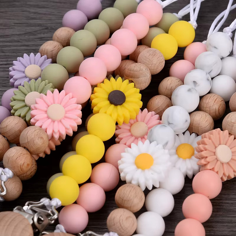 Schnullerhalter Kette für Babys aus Buche Holz und Silikon mit Blumenperlen in Mehrfarbig - Bild 2