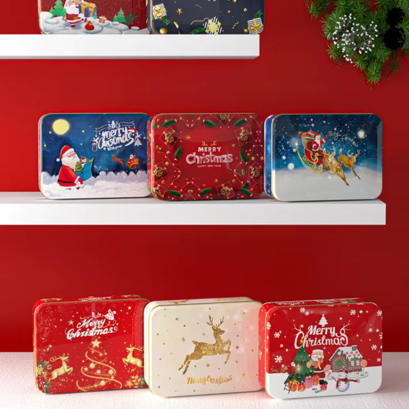 Weihnachtliche Metall-Süßigkeitenbox aus Weißblech mit Elch- und Weihnachtsmann-Motiv in Weiß und Mehrfarbig - Bild 2