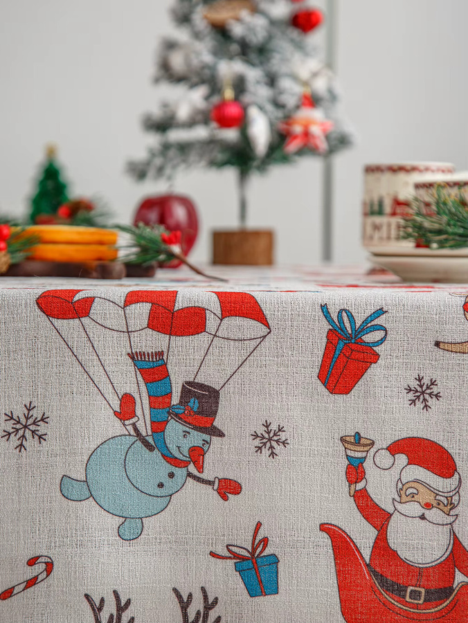 Waschbare Weihnachts-Tischdecke aus Leinen in Rot und Weiß mit Winter-Motiven wie Schneemann, Haus und Bäumen - Bild 2