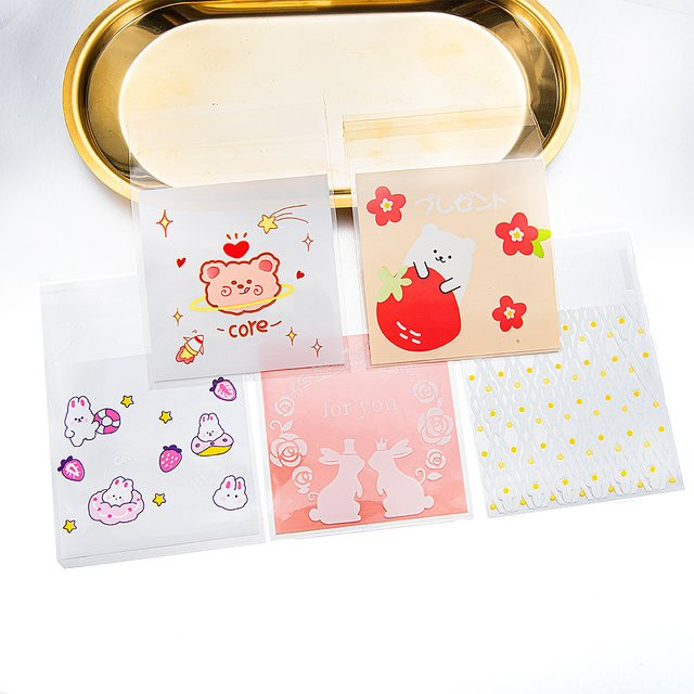 50 Stück MOONMADE selbstklebende OPP-Kunststoffbeutel mit Cartoon-Druck, transparent und selbstdichtend für Schmuck und Verpackungen - Bild 1