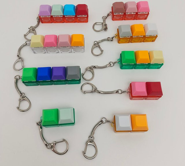 Handy-Anhänger Pop-Fidget-Schlüsselring, Unisex - Bild 1