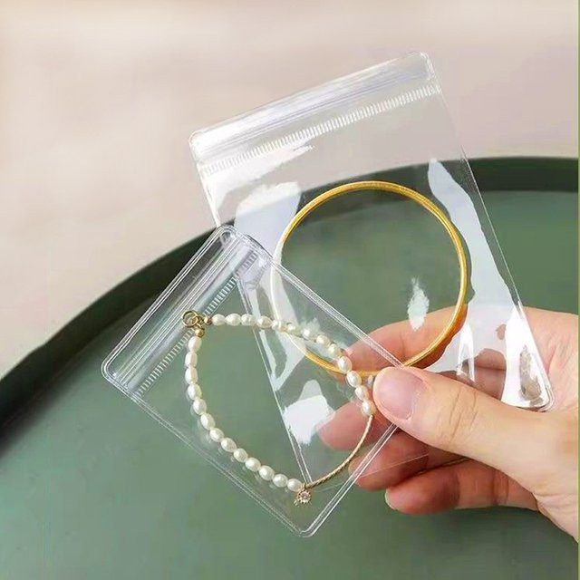 100 Stück transparente PVC-Schmuckbeutel mit selbstklebendem Verschluss für Reise und Einzelhandel - Bild 1