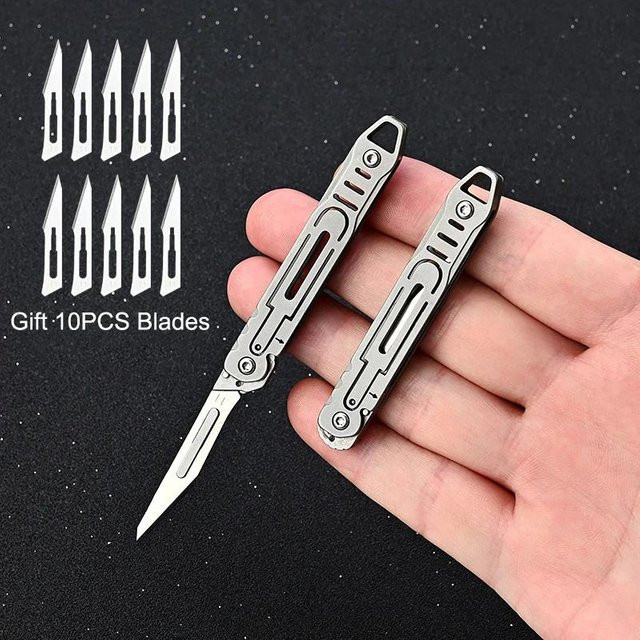 Swayboo Life Mini-Klappmesser aus Edelstahl in Silber mit schnellem Öffnungsmechanismus und 10 Ersatzklingen als tragbarer Schlüsselanhänger - Bild 1