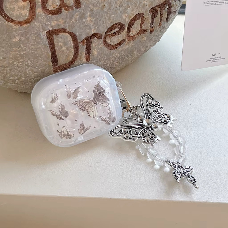 Silberne Schutzhülle mit Muschelstruktur-Muster und Schmetterling-Anhänger für Apple AirPods 1, 2, 3, 4 und Pro 2 - Bild 2