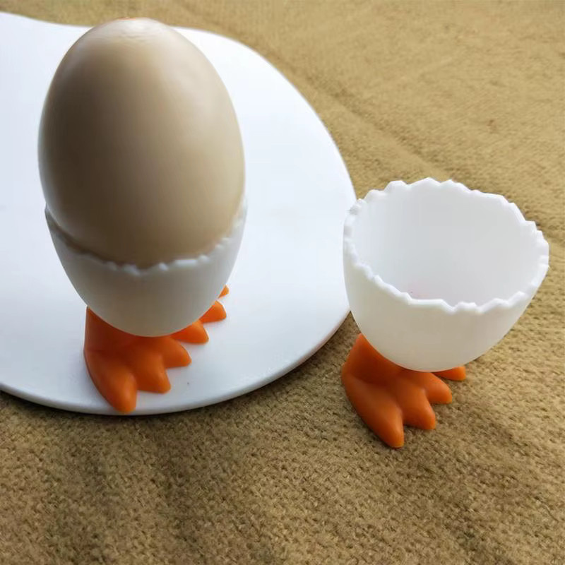 Kreativer Eierhalter in Huhn-Fuß-Optik für die Küche, weiß und orange, aus Kunststoff - Bild 2