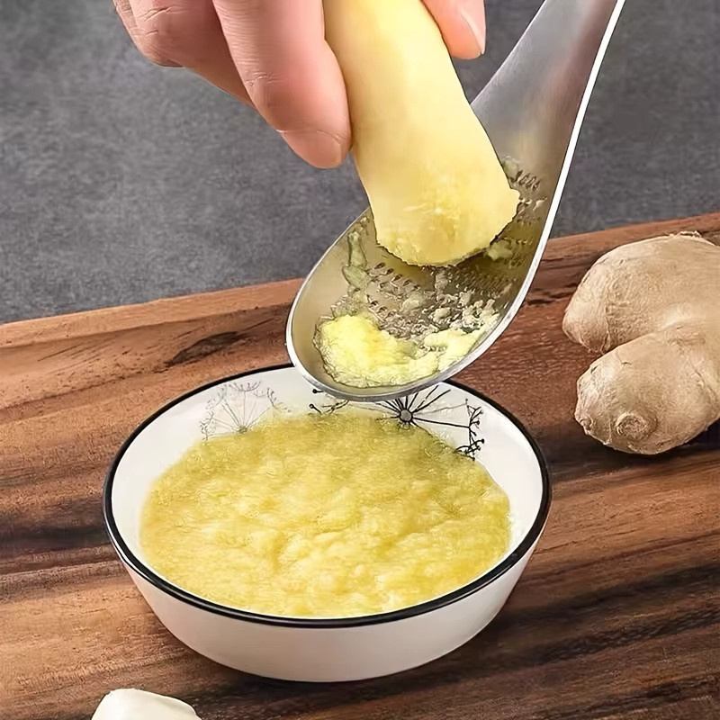 Edelstahl Knoblauchpresse und Reibe in Silber für Knoblauch, Ingwer, Obst und Gemüse mit Löffel-Funktion - Bild 5