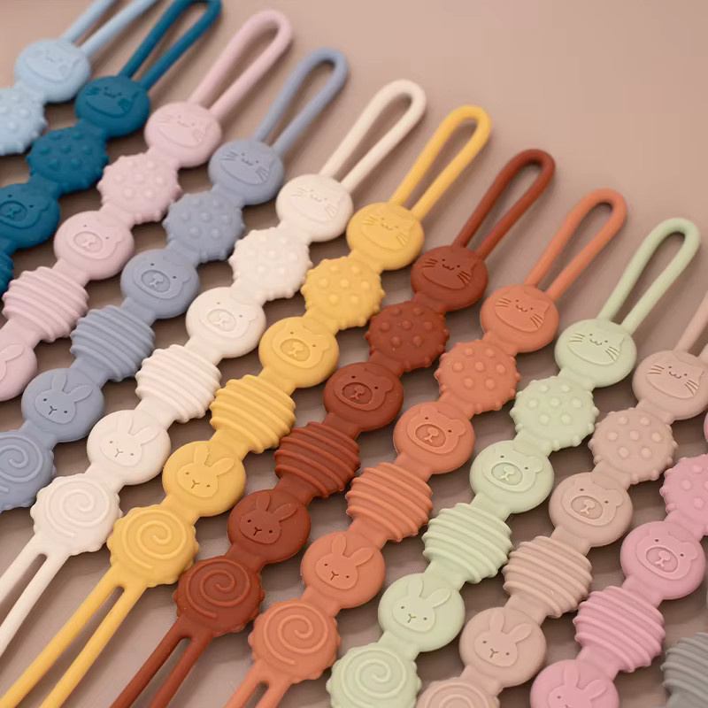 Silikon Baby Schnuller Kette mit niedlichem Tier Design in Orange und Multicolour als Anti-Verlust Lanyard und Zahnen-Spielzeug für Neugeborene - Bild 2