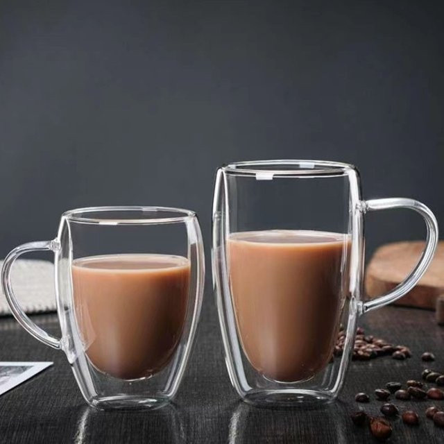 JUSTINLAU Doppelwandiger Glasbecher aus Borosilikatglas in Transparent, Hitzebeständige Kaffeetasse in Eiform mit Griff - Bild 1