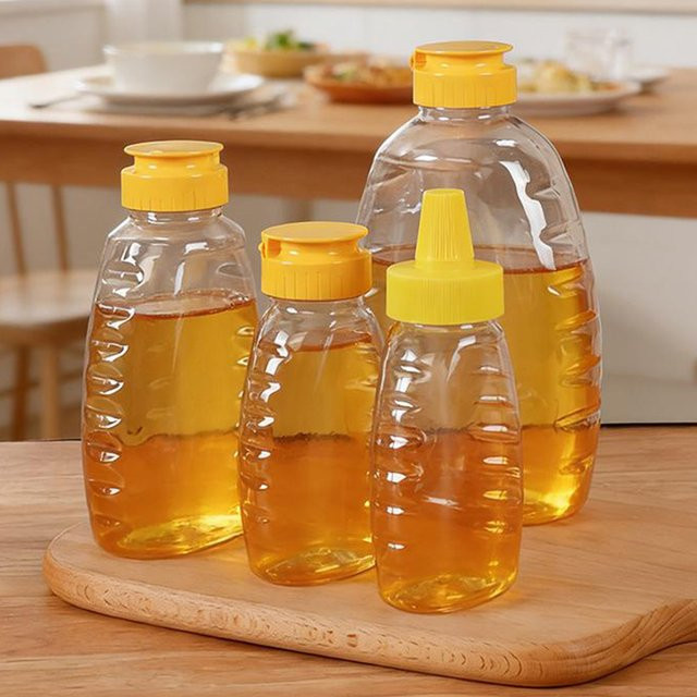 WHPHous Transparente Squeeze-Honigflasche aus Kunststoff mit Schraubdeckel zum Aufbewahren und Dosieren von Honig - Bild 1