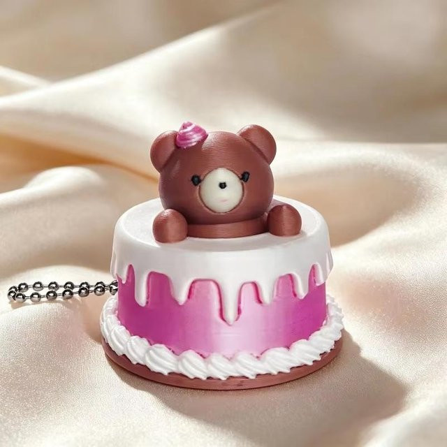 Schlüsselanhänger Cartoon-Kuchen-Klicker, brown, Unisex - Bild 1