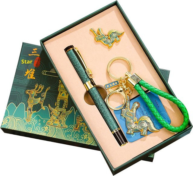 Sanxingdui Schlüsselanhänger und Gelstift-Set aus Messing mit Bronzekopf-Ornament und schwarzer Tinte in Gelb und Multicolour - Bild 1