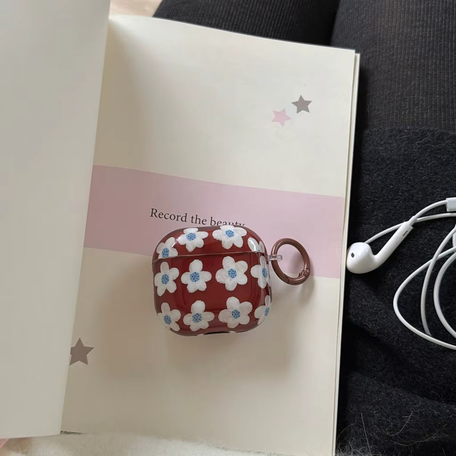 Apple Kopfhörer-Hülle für AirPods 1, 2, 3, 4, Pro 2 und Pro 3 mit braunem Hintergrund und weißen Blumen inklusive Haken - Bild 3