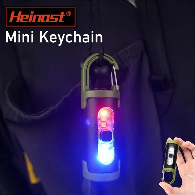 Heinast Wiederaufladbarer LED-Schlüsselanhänger mit RGB-Licht und USB-Ladefunktion, wasserdichte Mini-Taschenlampe für Outdoor, Camping und Notfälle - Bild 1