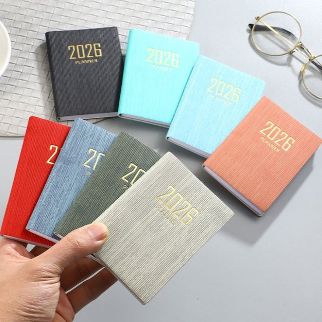 HUALIWEN Planbuch 2026 in Weiß, A7 Wochenkalender und Tagesplaner als kompaktes Softcover-Taschenbuch - Bild 1