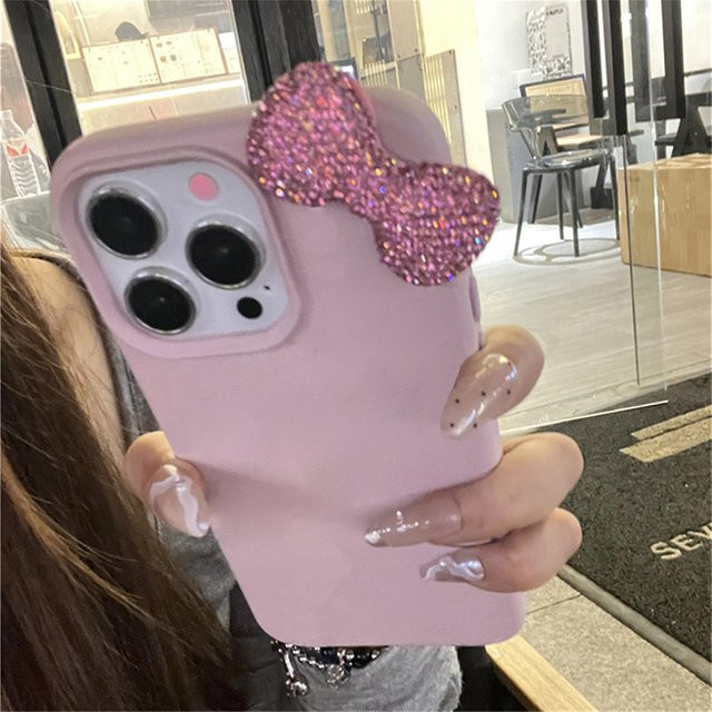 Luxus Handyhülle mit Strass-Schleife und Litschi-Muster aus Leder für Apple iPhone in Pink - Bild 1