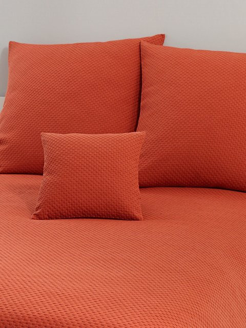 Tagesdecke von Pereira da Cunha in Terracotta und Orange aus 100% Baumwolle mit Waffelmuster für dein Bett - Bild 1