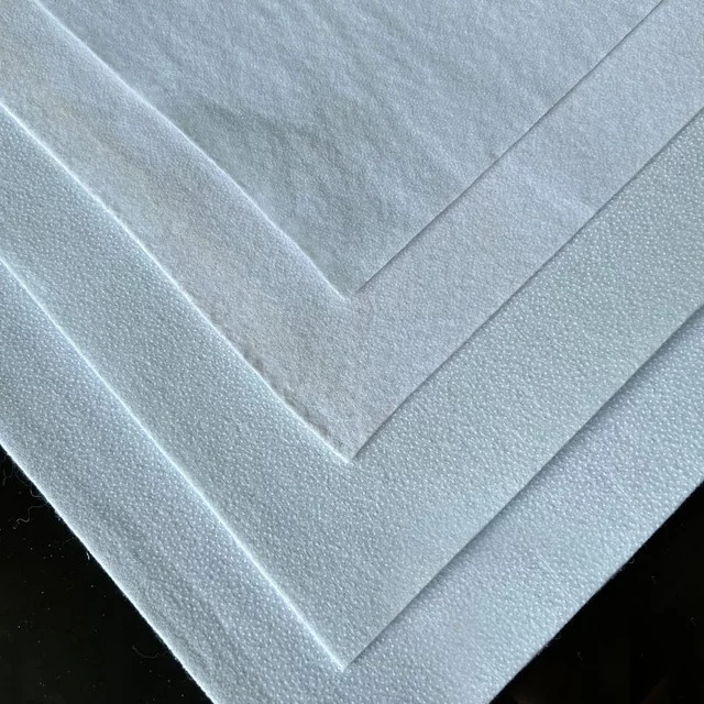 Einseitig klebender Baumwoll-Schlagcreme-Einlagenfüller in Weiß, B: 50 cm, T: 100 cm, 110 gsm - Bild 1
