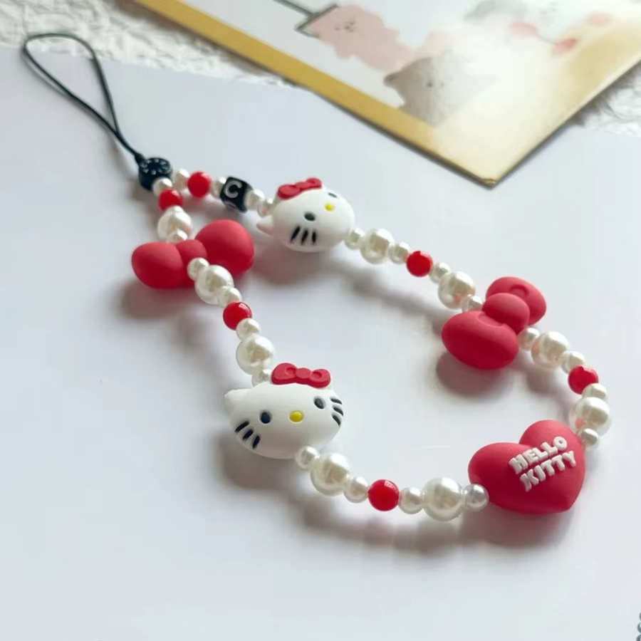 Sanrio Hello Kitty Handyhülle mit Anhänger und Anti-Verlust Handgelenkschlaufe in Rot für Damen - Bild 2