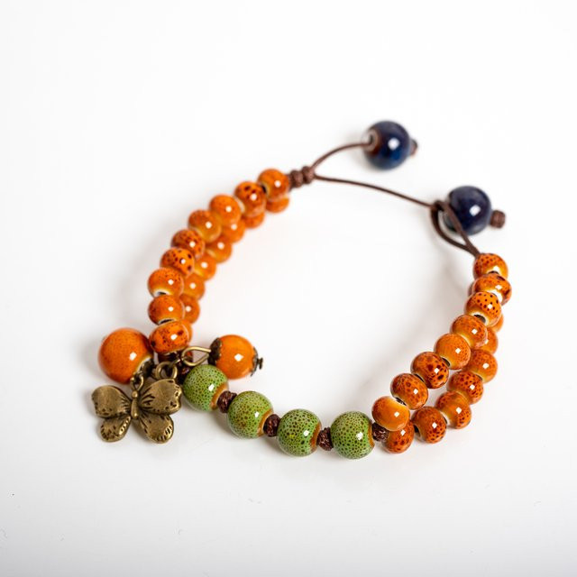 Armband mit Schmetterlings-Anhänger, Keramik, Orange-Grün, Unisex - Bild 1