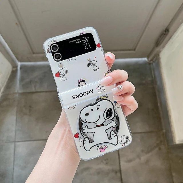 Snoopy und Charlie Brown Handyhülle mit magnetischem Halter und kabelloser Ladefunktion für Samsung Galaxy Z Flip 6 5 4 3 in Weiß - Bild 1