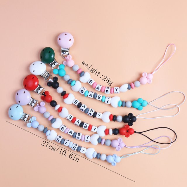 Cartoon Baby Schnuller Kette aus Silikon mit Perlen als Beißring und Kauspielzeug, BPA-frei, mehrfarbig und grün - Bild 1