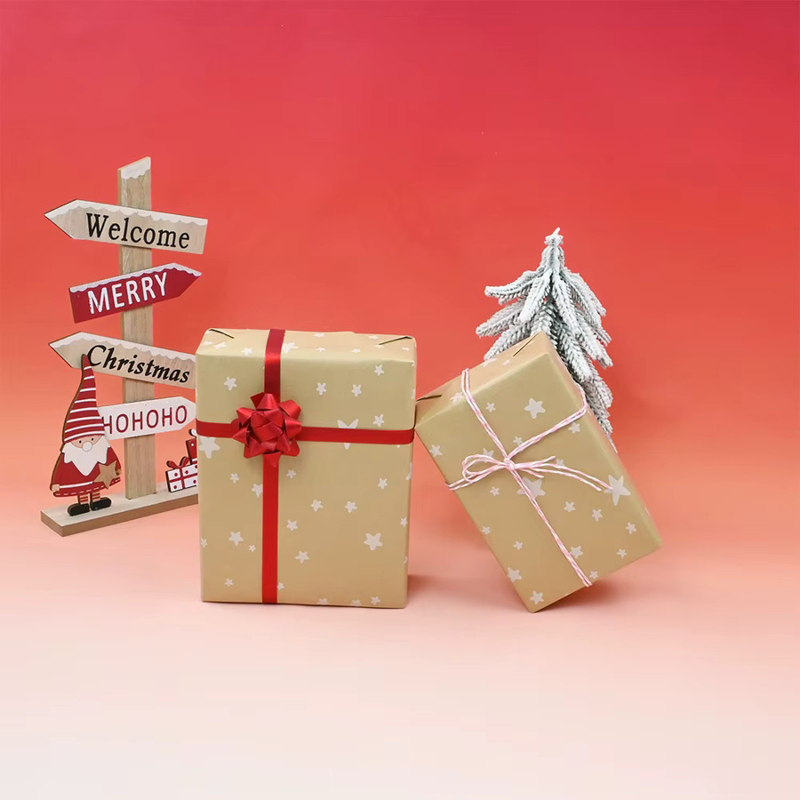 Braune Geschenkpapierrolle aus Kraftpapier mit Sternen und Streu für Weihnachten und Geburtstage - Bild 2