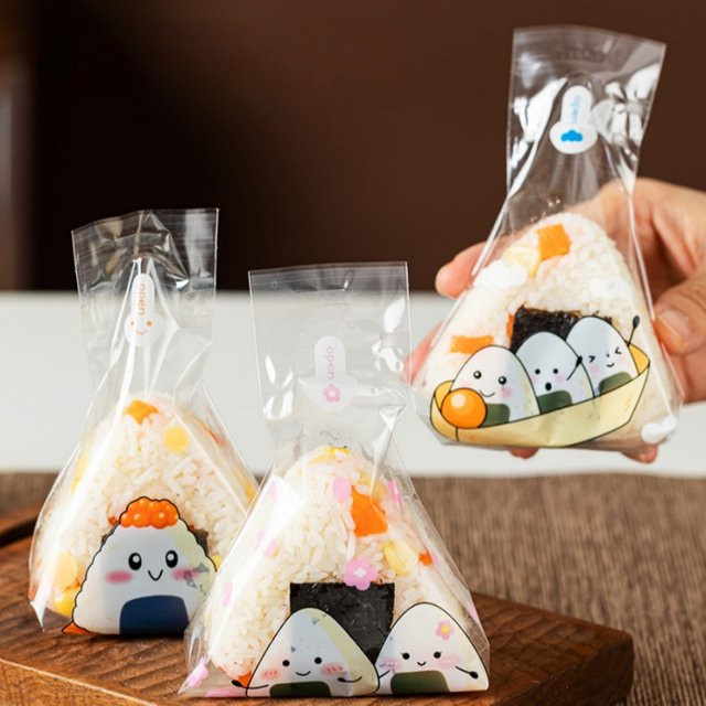 50 Stück Dreieckige Reisbällchen-Verpackungsbeutel für Sushi in Transparent mit Cartoon-Design - Bild 1