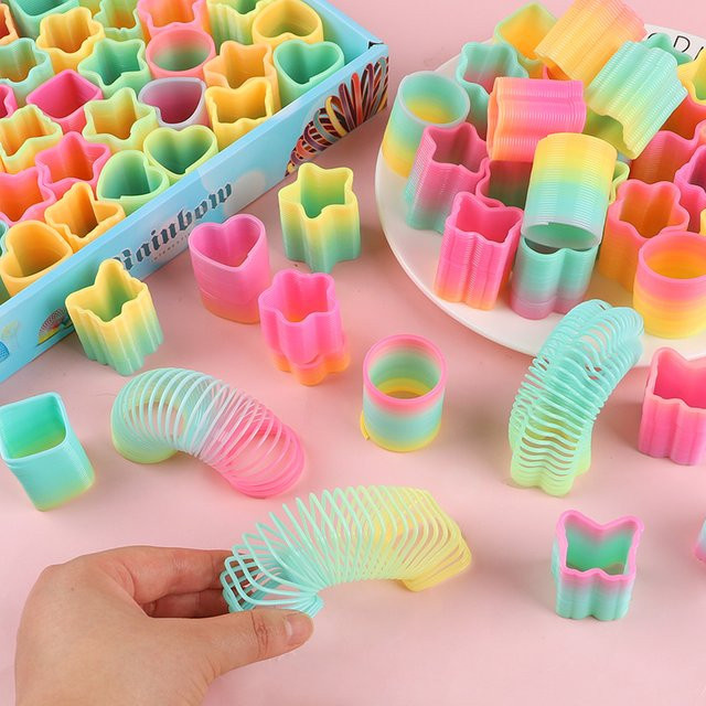 ZQNYCY Regenbogen-Magie-Frühlingsspielzeug für Kinder in Multicolour, 12 Stück - Bild 1
