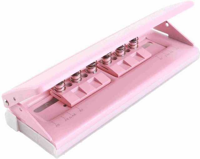 Shoemst 6-Lochstanzer aus Metall in Rosa mit einstellbarem Lochabstand und rutschfester Struktur für Planer-Einlagen - Bild 1