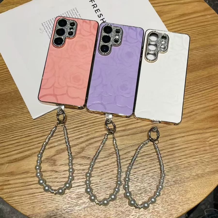 Elegante Glitzer-Strass-Kameraschutzhülle mit Kamelien-Design in Weiß für Samsung Galaxy S26 S25 S24 S23 Ultra Plus FE inklusive Trageriemen - Bild 1