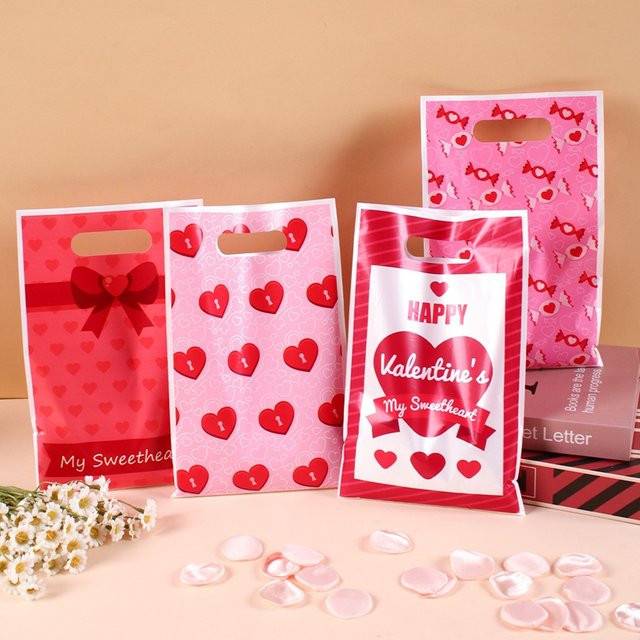 50 Stück rosa Kunststoff-Geschenktüten mit Herzdesign für Valentinstag und Hochzeitsdekoration - Bild 1