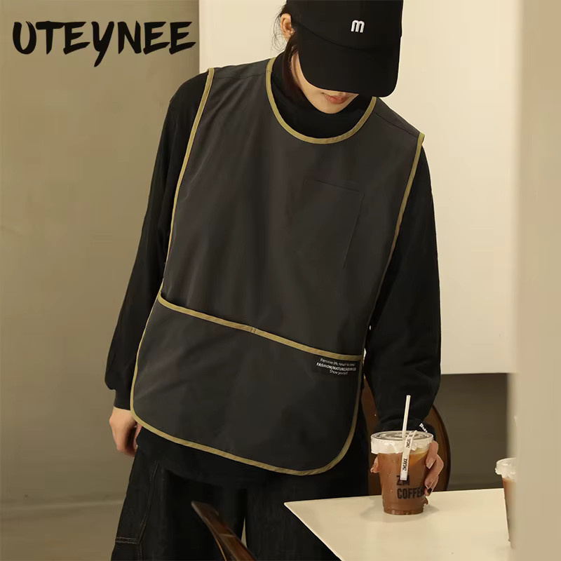 Ölbeständige und wasserdichte Schürze Weste von Uteynee in Schwarz mit Taschen für Café, Restaurant und Salon - Bild 1
