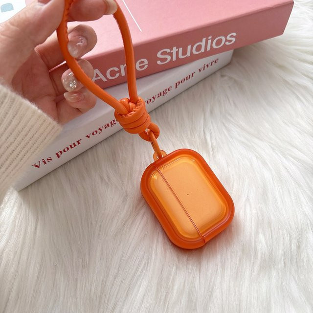 Transparente Schutzhülle für Apple AirPods in Orange mit Handschlaufe - Bild 1