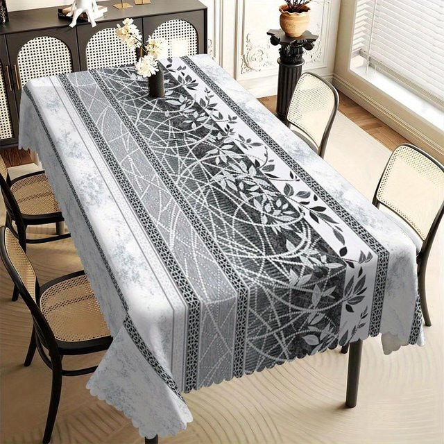 Schmutzabweisende Tischdecke von JMG Household Supplies in Schwarz-Weiß mit modernem geometrischem Blattmuster und Muschelrand, B/L: 140 x 160 cm - Bild 1