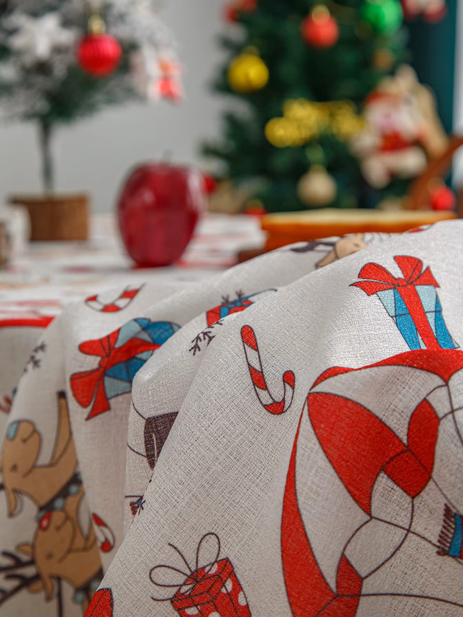 Waschbare Weihnachts-Tischdecke aus Leinen in Rot und Weiß mit Winter-Motiven wie Schneemann, Haus und Bäumen - Bild 3