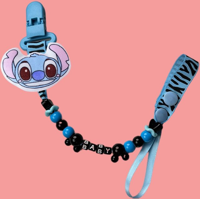 Disney Baby-Nippelklemme mit Cartoon-Motiv als Kauspielzeug und Nippelhalter in Rot und Blau - Bild 1