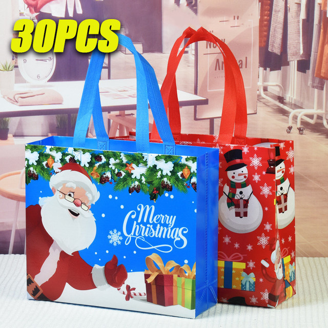 Wasserdichte Weihnachtsgeschenktüten aus Vliesstoff mit Weihnachtsmann Elch und Schneeflocken Motiv in Blau - Bild 1