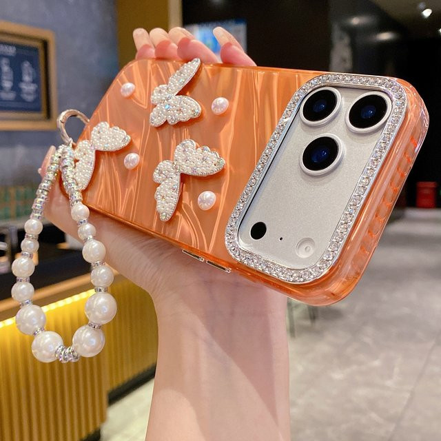 Luxus Diamant-Schmetterlings-Hülle mit Perlenarmband für Apple iPhone 17 Pro Max, 16 Pro, 15 Pro Max, 14 Pro, 13 Pro, 12 Pro in Orange - Bild 1