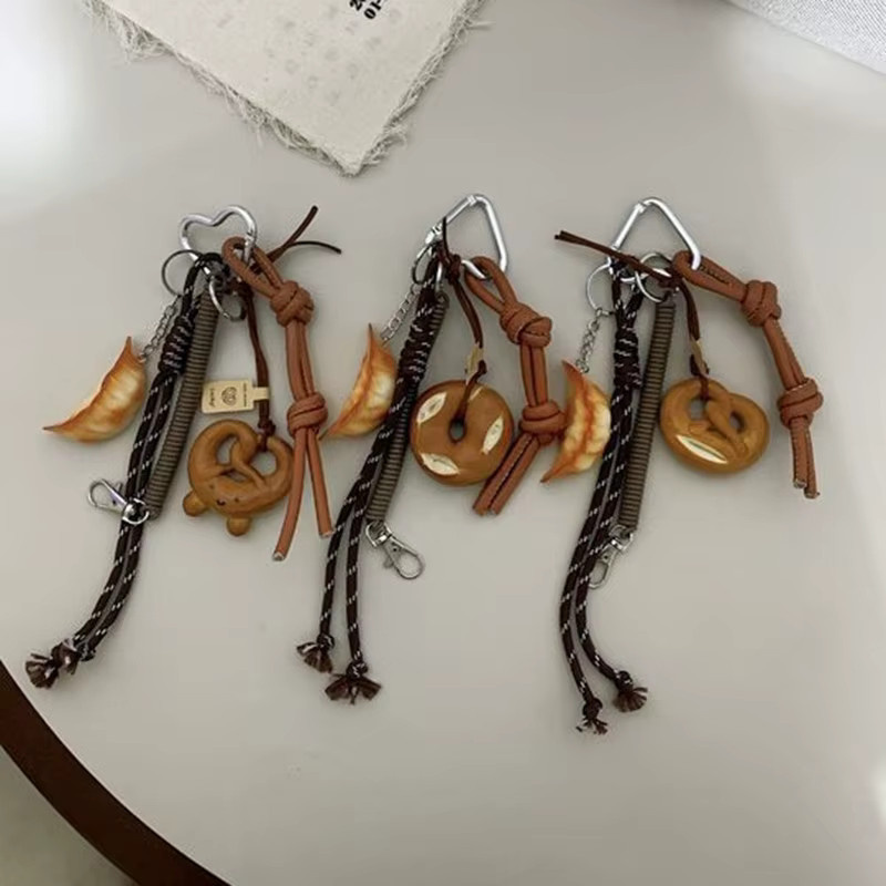Yogodlns Schlüsselanhänger, Lächelnder Bagel, Geflochtener Seilanhänger, Unisex - Bild 2