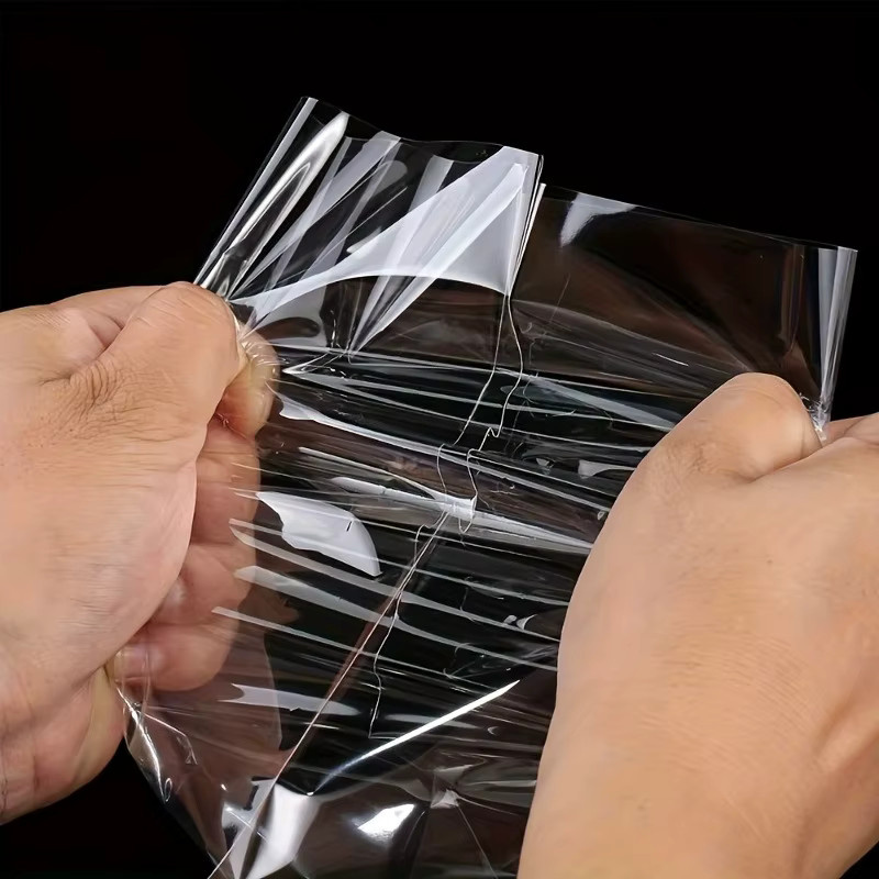 50 Stück transparente Geschenktüten aus Kunststoff mit drehbarem Riemen-Design von DUTRIEUX für Geburtstage und Weihnachtsfeiern - Bild 3