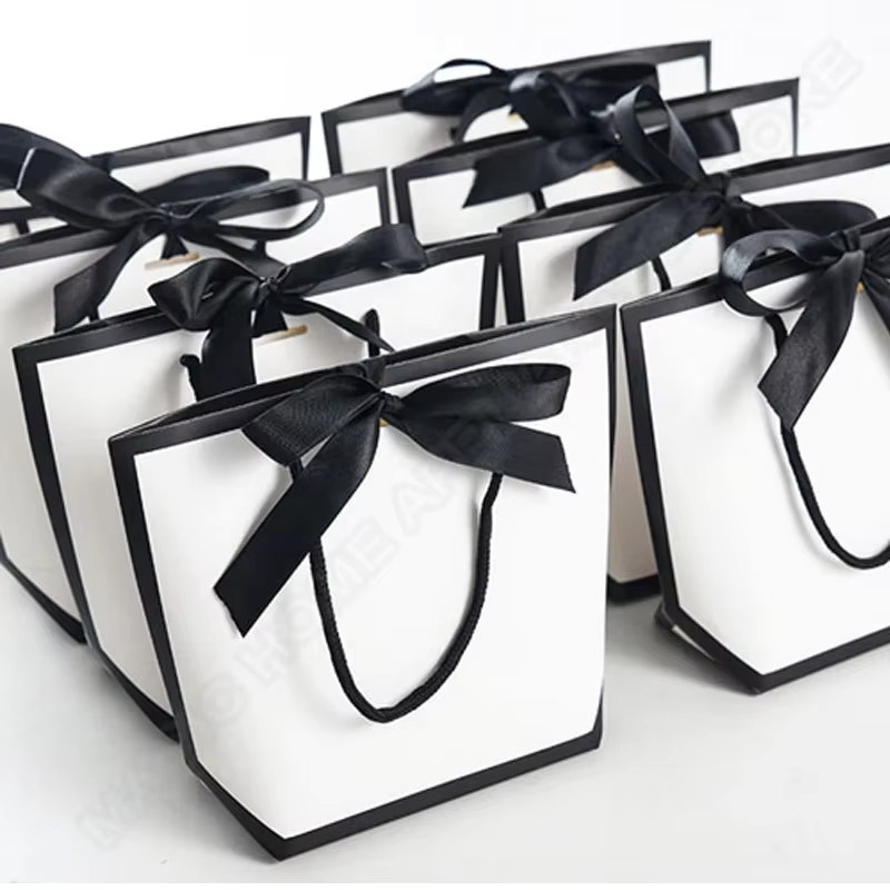 50 weiße Papiertüten mit Schleife und Griffen für Geschenke, Hochzeiten und Partys - Bild 3