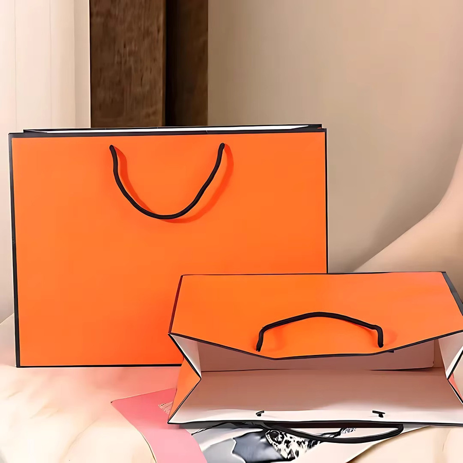 Orangefarbene Papptüten aus Papier für Geschenke und Einkäufe - Bild 4