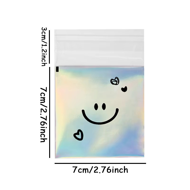 100 Stück transparente Laser-Keksbeutel mit selbstklebendem Verschluss und süßem Smiley-Motiv für Geburtstage und Partys - Bild 2