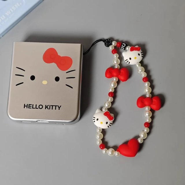 Sanrio Hello Kitty Handyhülle mit Anhänger und Anti-Verlust Handgelenkschlaufe in Rot für Damen - Bild 1